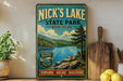 A vintage-style sign for Nick's Lake State Park in New York, featuring a scenic landscape with a lake, mountains, and pine trees.