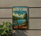 A vintage-style sign for Nick's Lake State Park in New York, featuring a scenic landscape with a lake, mountains, and pine trees.