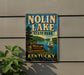 A vintage-style sign for Nolin Lake State Park in Kentucky, featuring a sailboat on the lake and a scenic landscape.