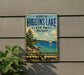 A vintage-style metal sign for North Higgins Lake State Park in Michigan, featuring a scenic image of a lake with a sailboat and pine trees.