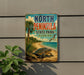 A vintage-style sign for North Peninsula State Park in Florida, featuring a beach scene with a turtle and palm trees.
