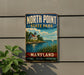 A vintage metal sign for North Point State Park in Maryland, featuring a lighthouse and a seascape.