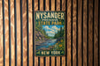 A vintage-style metal sign for Nysander Preserve State Park in New York, featuring a scenic landscape with a waterfall and pine trees.