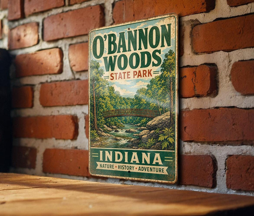 A vintage-style metal sign for O'Bannon Woods State Park in Indiana, featuring a scenic illustration of a forest and a bridge.