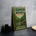 A vintage-style sign for O'Bannon Woods State Park in Indiana, featuring a scenic illustration of a forest and a bridge.
