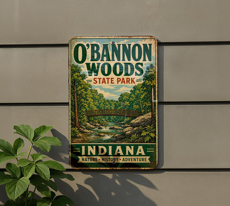 A vintage-style metal sign for O'Bannon Woods State Park in Indiana, featuring a scenic illustration of a forest and a bridge.