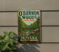A vintage-style metal sign for O'Bannon Woods State Park in Indiana, featuring a scenic illustration of a forest and a bridge.