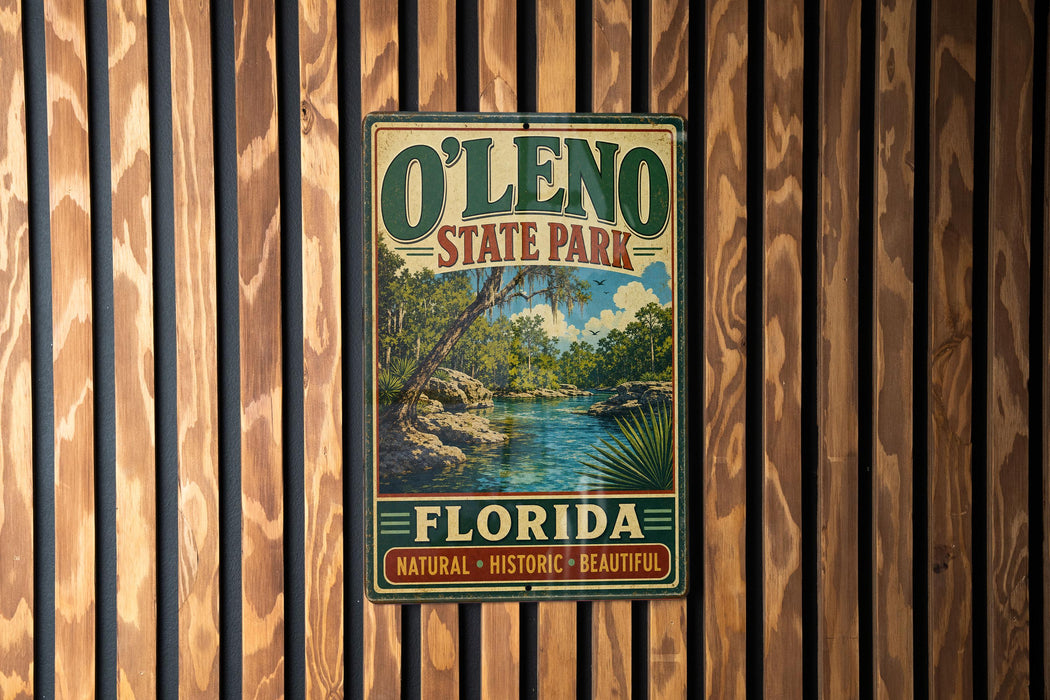 A vintage-style sign for O'Leno State Park in Florida, featuring a scenic landscape with a river and palm trees.