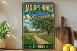a vintage-style sign for Oak Openings Preserve Metropark, with a scenic landscape of a winding path surrounded by trees and flowers.