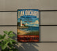 A vintage-style metal sign for Oak Orchard State Marine Park in New York, featuring a lighthouse and a beach scene.
