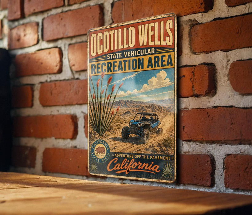 A vintage-style metal sign for the Ocotillo Wells State Vehicular Recreation Area, featuring a desert landscape with a blue off-road vehicle and the text "Adventure off the pavement - California".