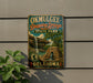 A vintage-style sign for Okmulgee-Drip Springs State Park in Oklahoma, featuring a waterfall and a stone structure.