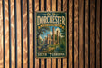 A vintage-style metal sign for Dorchester State Historic Park in South Carolina, featuring an illustration of a cannon and a tropical landscape.