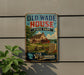A vintage-style metal sign for Old Wade House State Park in Wisconsin, featuring an illustration of a historic house surrounded by a lush green landscape.