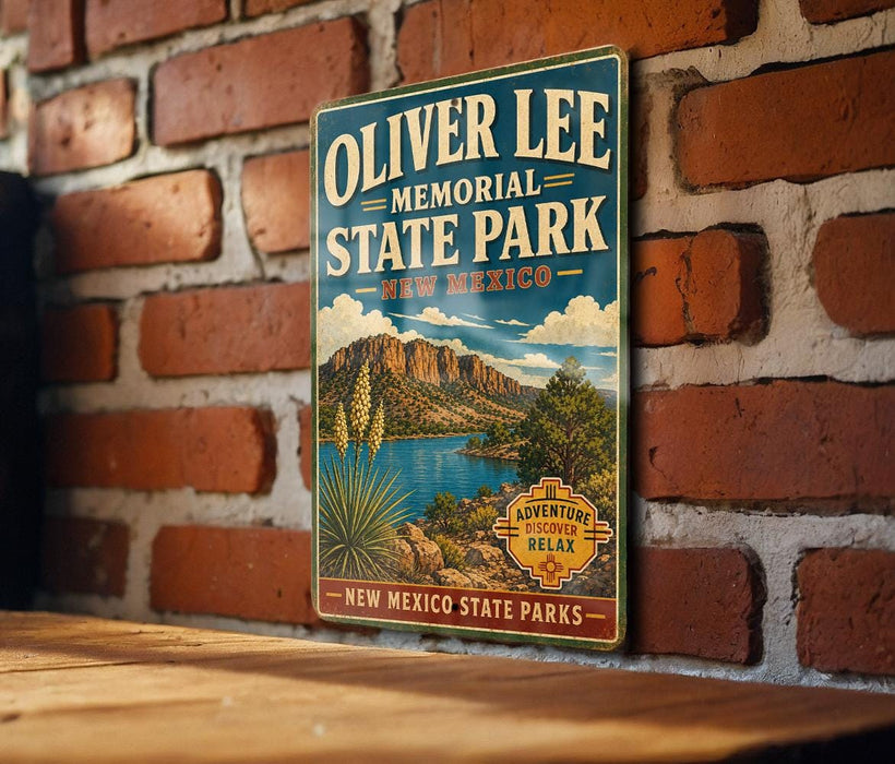 A vintage-style metal sign for Oliver Lee Memorial State Park in New Mexico, featuring a scenic landscape with mountains, a lake, and desert vegetation.