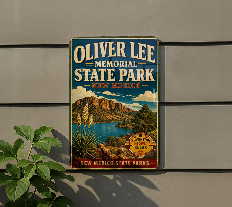 A vintage-style metal sign for Oliver Lee Memorial State Park in New Mexico, featuring a scenic landscape with mountains, a lake, and desert vegetation.