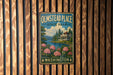 A vintage-style metal sign for Olmstead Place State Park in Washington, featuring a scenic landscape with a house, flowers, and a lake.