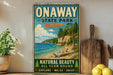 A vintage-style sign for Onaway State Park in Michigan, featuring a scenic beach landscape with pine trees and a cliff overlooking the water.