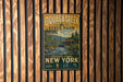 A vintage-style metal sign for Quagga Creek State Park, featuring a scenic illustration of a bridge and a river, mounted on a wooden wall.