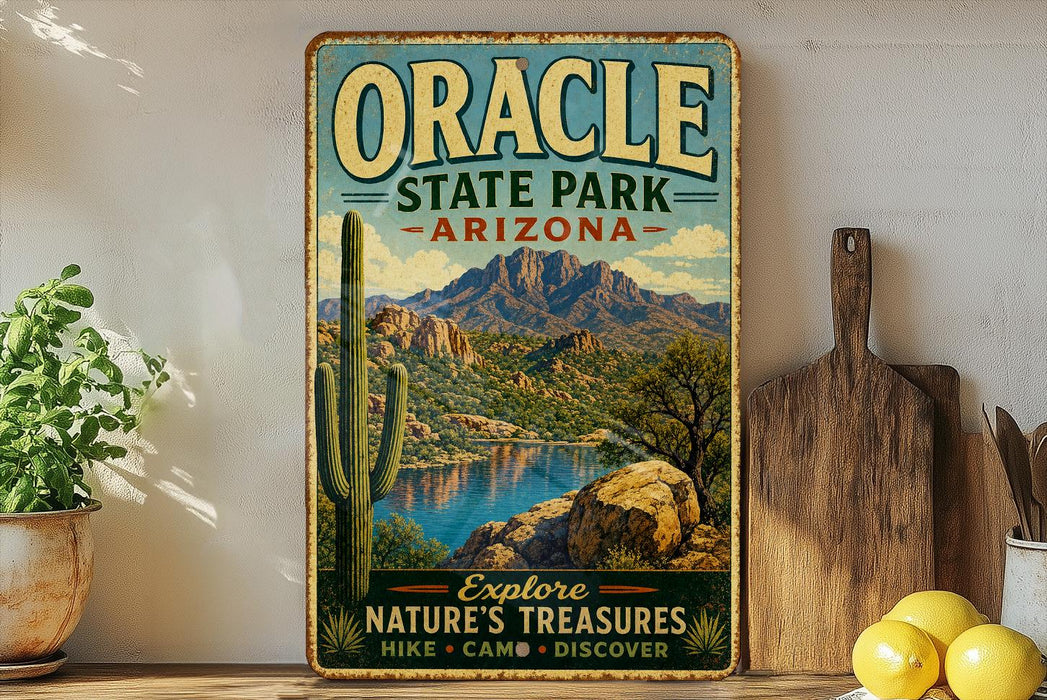 A vintage-style metal sign for Oracle State Park in Arizona, featuring a scenic mountain landscape with a lake and cactus in the foreground.