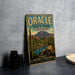 A vintage-style metal sign for Oracle State Park in Arizona, featuring a desert landscape with mountains, cacti, and a lake.