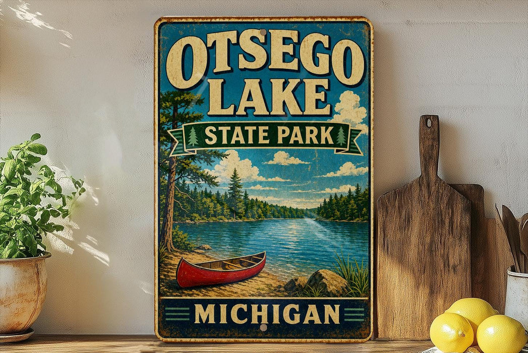 A vintage-style sign for Otsego Lake State Park in Michigan, featuring a scenic image of a lake, canoe, and forest.