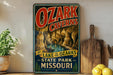 A vintage-style sign for Ozark Caves, located at Lake of the Ozarks State Park in Missouri.