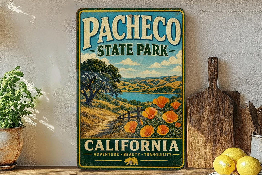 A vintage-style metal sign for Pacheco State Park in California, featuring a scenic landscape with a path, trees, and a lake.