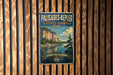 A vintage-style metal sign for Palisades-Kepler State Park, Iowa, featuring a scenic landscape with a lake and cliffs.