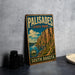 A vintage metal sign for Palisades State Park in South Dakota, featuring a scenic landscape with mountains and a lake.
