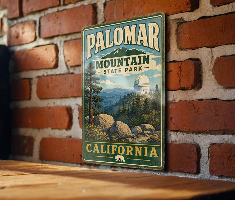 A vintage-style metal sign for Palomar Mountain State Park in California, featuring a scenic landscape with mountains, trees, and a large dome structure.