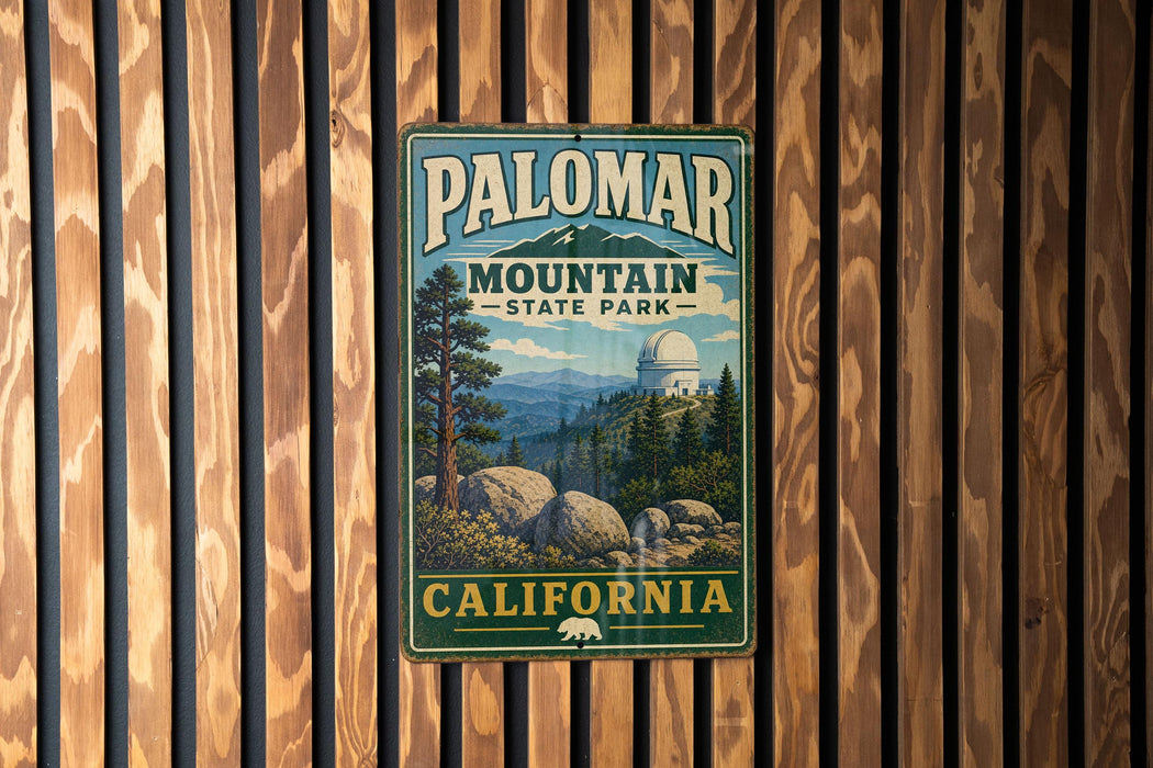 A vintage metal sign for Palomar Mountain State Park in California, featuring a scenic illustration of the park's landscape.