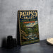 A vintage-style metal sign for Patapsco Valley State Park in Maryland, featuring a scenic illustration of a river and bridge.