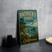 A vintage-style metal sign for Patrick's Point State Park in California, featuring a scenic landscape with mountains, trees, and the ocean.