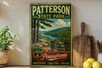 A vintage-style metal sign for Pennsylvania State Park, featuring a scenic mountain landscape with pine trees and a river.