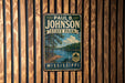 A vintage metal sign for Paul B. Johnson State Park in Mississippi, featuring a scenic landscape with a lake and pine trees.