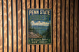A vintage metal sign for Penn State Forest, New Jersey, featuring a scenic mountain landscape with pine trees.