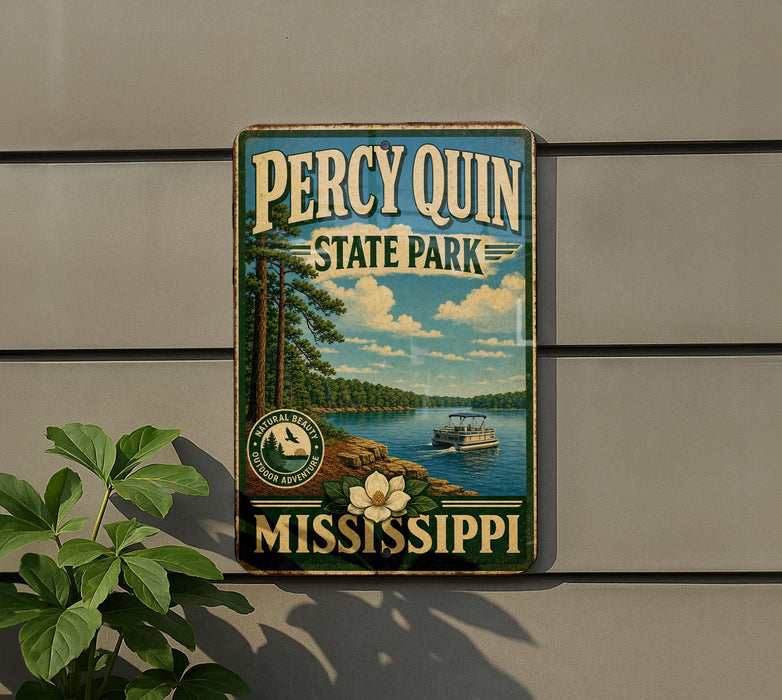 A vintage-style metal sign for Perry Quinn State Park in Mississippi, featuring a scenic landscape with a lake, trees, and a boat.