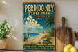 A vintage-style poster of Perdido Key, Florida, featuring a beach scene with a heron, palm trees, and a turtle, along with the text "PERDIDO KEY STATE PARK FLORIDA" and "NATURAL BEAUTY - COASTAL ADVENTURE".