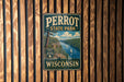 A vintage metal sign for Perrot State Park in Wisconsin, featuring a scenic landscape with a river, mountains, and a sailboat.