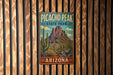 A vintage-style metal sign for Picacho Peak State Park in Arizona, featuring a mountain landscape and desert vegetation.