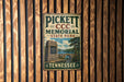 A vintage metal sign for Pickett Memorial State Park in Tennessee, featuring a scenic illustration of the park's memorial and surrounding landscape.