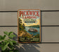 A vintage-style sign for Pickwick Landing State Park in Tennessee, featuring a scenic image of a riverboat on a wooden paddle boat.