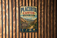 A vintage metal sign for Placerita Canyon State Park, California, featuring a scenic mountain landscape and various icons representing nature, wildlife, and history.