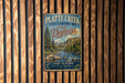 A vintage metal sign for Platte Creek State Recreation Area in South Dakota, featuring a scenic landscape with a river and mountains.