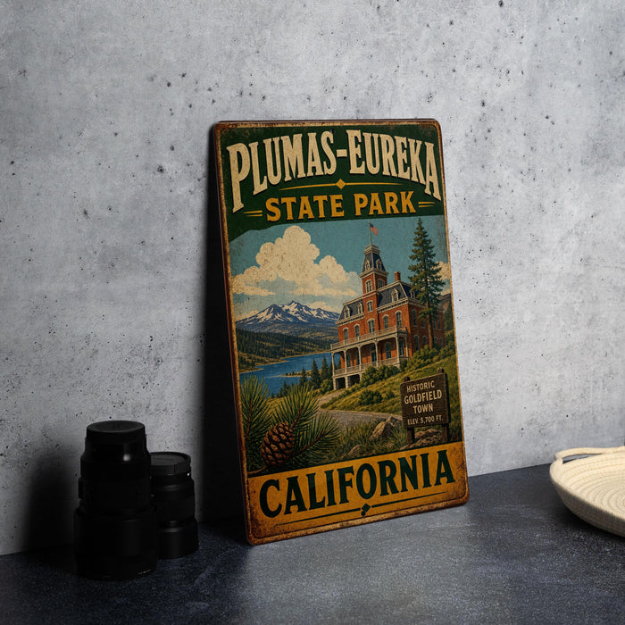 A vintage-style sign for Plumas-Eureka State Park in California, featuring an illustration of a historic building and a scenic landscape.