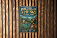 A vintage-style metal sign for Ponce de Leon Springs State Park in Florida, featuring an illustration of a man in historical attire and the text "Where Florida's History Comes to Life".