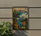 A vintage-style metal sign for Ponderosa State Park in Idaho, featuring a scenic landscape with mountains, trees, and a lake.