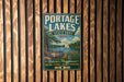 A vintage-style metal sign for Portage Lakes State Park in Ohio, featuring a scenic illustration of a lake, a dock, and a sailboat.