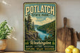 A vintage-style sign for Potlatch State Park, featuring a scenic image of a river surrounded by pine trees and mountains.